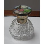 A Decorative Enamel Topped Dressing Table Scent Bottle, of crinoline lady style highlighted in