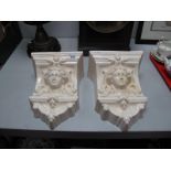 A Pair of Albion Ceramics White Pottery Wall Pockets, each with female mask to fascia.