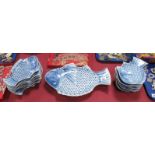 Oriental Blue & White Pottery, twelve fish plates and matching serving plate (cracked) all with