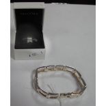 A Silver Link Bracelet, together with a Pandora charm as a car.