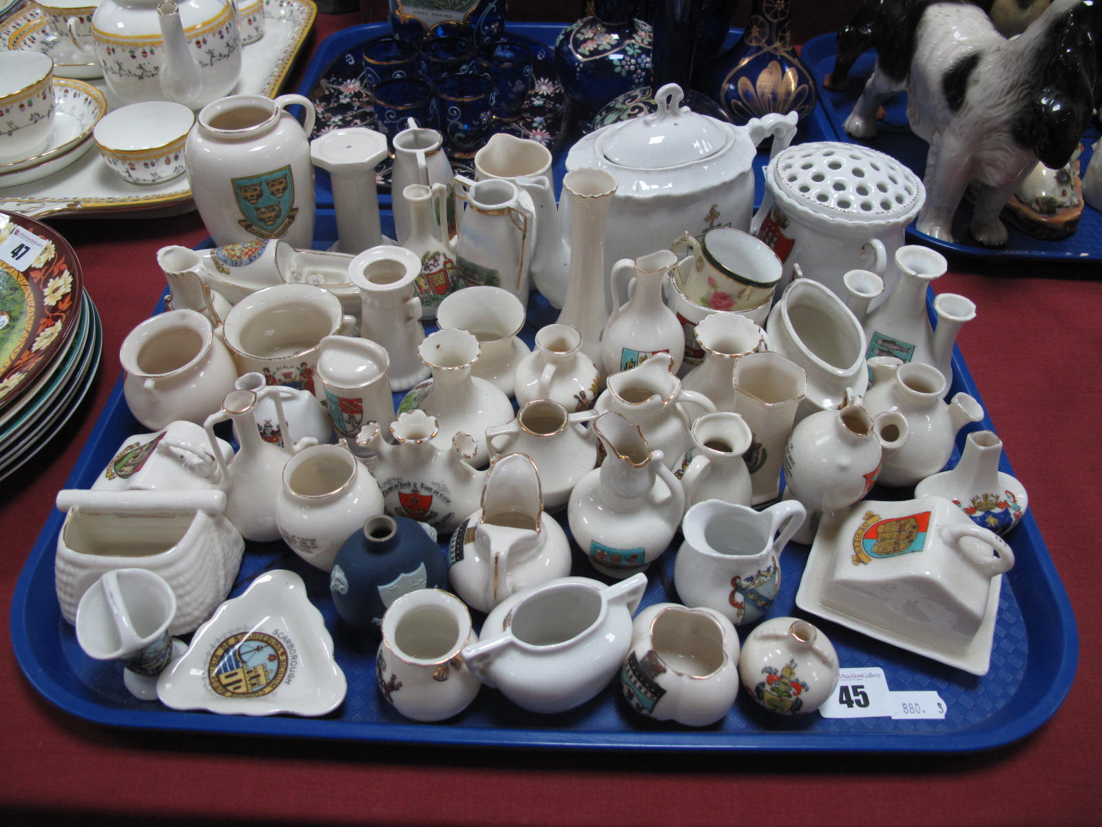 A Goss Pitcher, Southport teapot, Goss Jersey fish basket, Carlton cauldron, Wedgwood Wellington