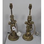 A Pair of Brass Table Lamps, with twin cherub supports.