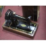 A Mahogany Cased Singer Sewing Machine.