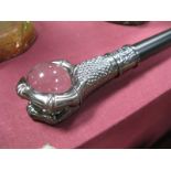 A Gothic Style Walking Stick, with a three clawed hand holding a clear glass ball.