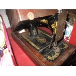 A Singer Sewing Machine, (cased).