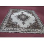 A Patterned Carpet, border with wheel decoration, central motif, tassel ends, 262cm by 342cm.
