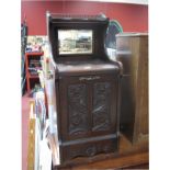 A Late Victorian Mahogany Pardonium, with carved foliate fall front below galleried and mirrored