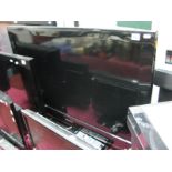 A Samsung Flatscreen TV Model LE40B530P7W, with remote control.