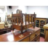 A Reproduction Mahogany Canterbury, with finial top, rail supports, single drawer, on brass