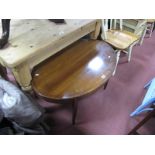 An Oval Shaped Mahogany Coffee Table, on tapering legs.