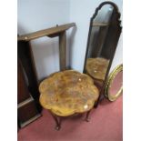 A Walnut Coffee Table, with rounded octagonal top, cabriole legs, ball and claw feet.