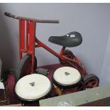 LP Aspire Hand Drums, a mid XX Century child's tricycle.