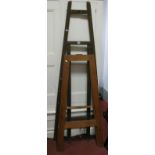 A Pitch Pine Artists Folding Easel, 120cm high, another larger. (2)