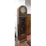 A 1920's Oak Cased Three Weight Long Case Clock, with glazed door, circular dial, domed hood, Arabic