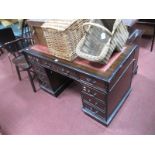 A Mahogany Desk, with inset scriver and eight various drawers, on two pedestals.