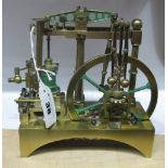 A XIX Century Brass Model of a Three Pillar Beam Engine with Regulator, 6 inches long, 6 1/2 inches