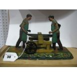 An Early XX Century Toy Shop Steam Accessory, of two men sawing a block of wood by Bing of
