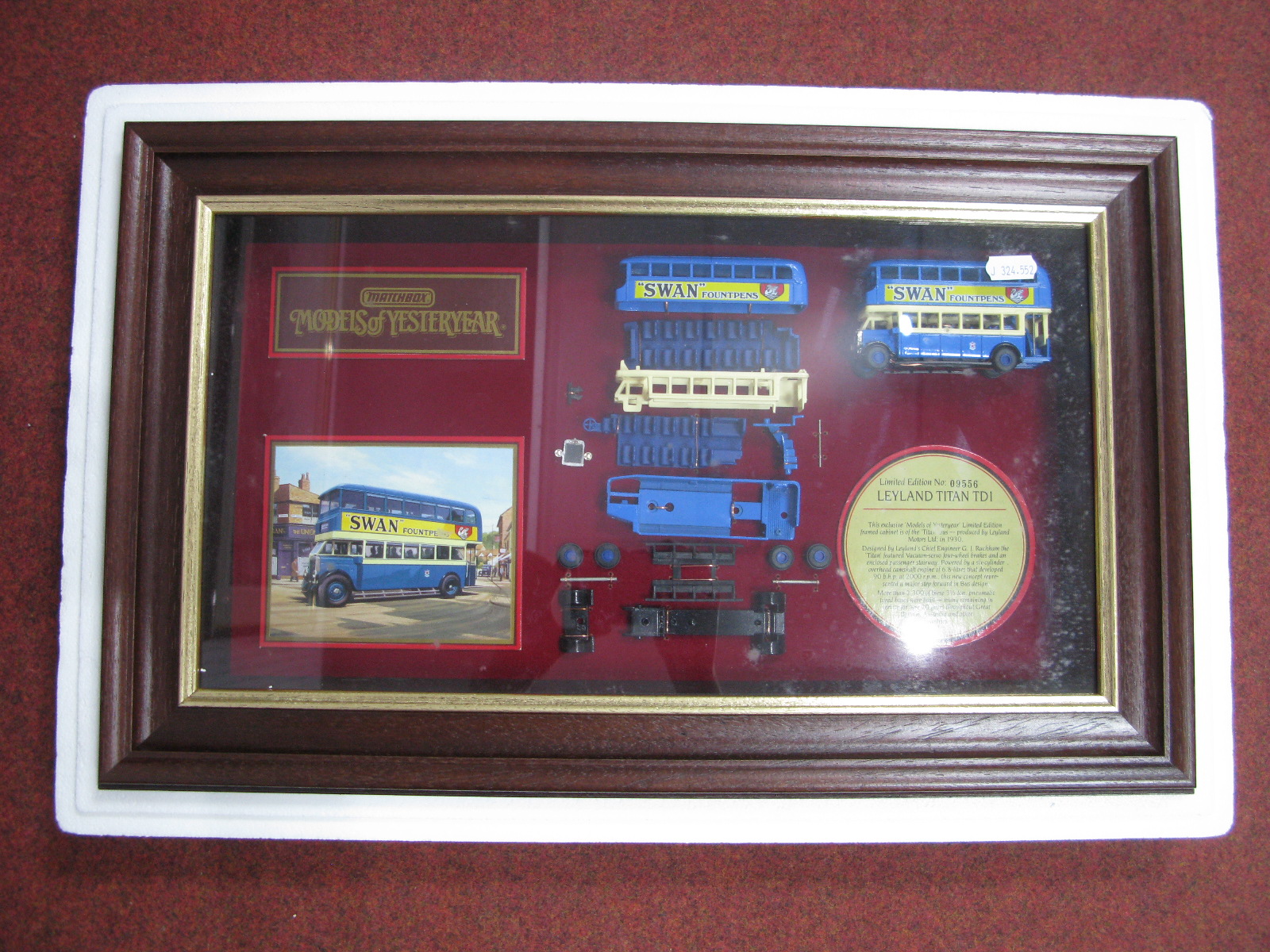A Matchbox Wooden Display Case Diecast Model Leyland Titan, No. 09556.