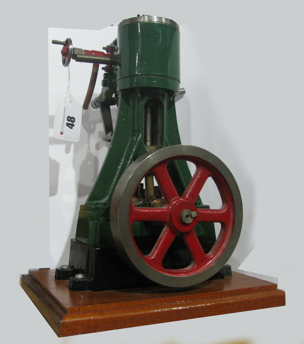 A Stuart No. 4 Vertical Steam Engine, with balanced disk flywheel, built and finished to a good