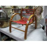 A XX Century French Child's Chair, with red rail support, hooped arms.