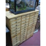 A Pine Specimen Cabinet, circa 1900, with three banks of a total of thirty-six drawers, 88cm wide,