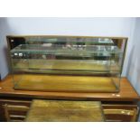 A Mid 1900's Shop Counter Cabinet, with internal shelf and wooden base, 42" long.