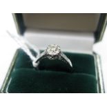 A Single Stone Diamond Ring, the old cut stone illusion set, stamped "W/Gold" Plat". *Bradley's