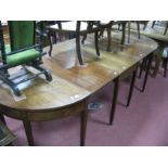 A Georgian Mahogany Three Sectional Dining Table, with 'D' ends, chevron and stringing inlay, on