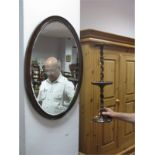 An Oak Barley Twist Smokers Companion Stand, oval bevelled wall mirror in mahogany frame.