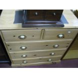 A Straight Fronted Pine Chest, of two small and three large drawers, on shaped base.