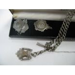 A Curb Link Double Albert Chain, suspending T-bar and medallion pendant with applied cricket bats
