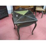 A Late XIX Century Ebonised Fold-Over Card Table, with four lift-up flaps concealing baize interior,