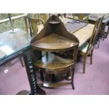 A XIX Century Mahogany Corner Washstand, with a shaped back with upper shelf, single drawer, two