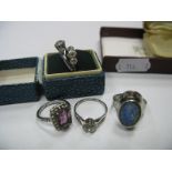 A Solitaire Ring, stamped 9ct, 9ct silver three stone ring, three others. (5)