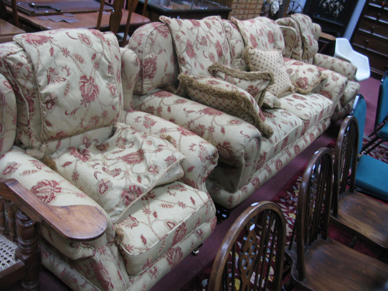 Heritage House Three Piece Lounge Suites, with floral decoration on mustard ground, on turned legs.