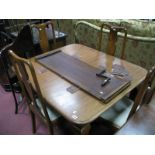 A 1920's Mahogany Extending Dining Table, with wind out action, spare leaf, on cabriole legs,