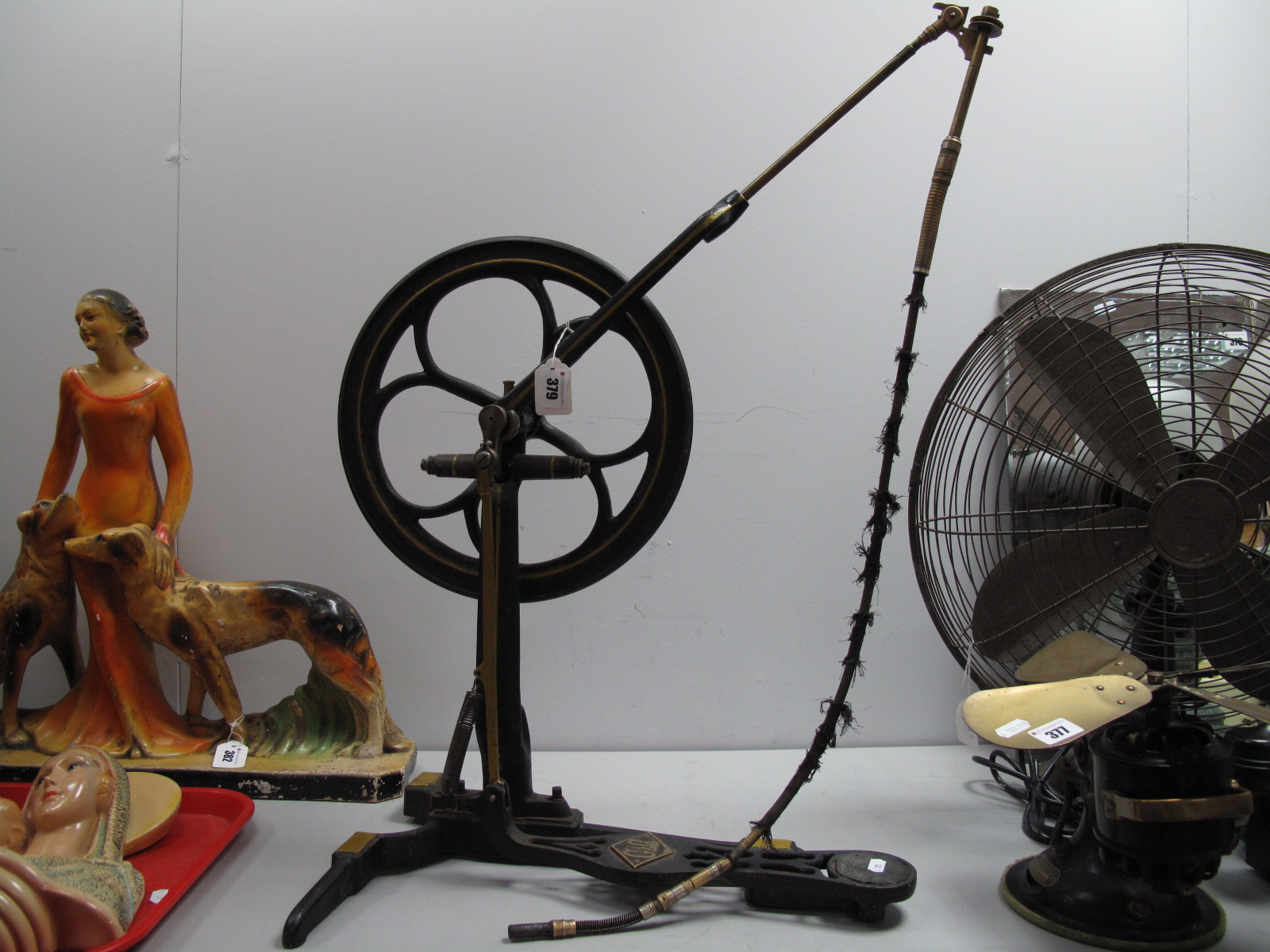 G and Co Treadle Dental? Implement, with brass fittings to iron wheel on base, 46cm wide.