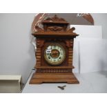 A XIX Century Oak Cased Ansonia 'Syria' Mantel Clock, with eight day movement.