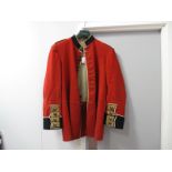 A Bandsman's Red Jacket, with brass lyre buttons, labelled Army and Navy Supply.