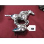 A Chrome Car Mascot as a Racehorse with Rider, 16.5cm wide.