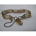 A Geometric Link Bracelet, to 9ct gold heart shape padlock style clasp.