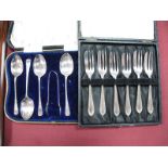 A Set of Silver Hallmarked Tea Forks, including a part fitted teaspoon set, (both cased). (2)