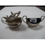 A Matched Silver Hallmarked Two Piece Condiment Set, of semi lobed oval form, scroll handles. (2)