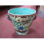 A Continental Majolica Pottery Jardiniere, with foliage to ribbed body and twin lion mask handles,