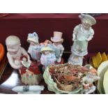 A WWI (Victoria China) Zeppelin, XIX Century Piano baby, three XIX Century figures, Grandma,