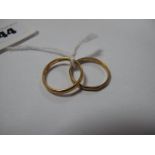 A 22ct Gold Plain Wedding Band; together with a 9ct gold band ring. (2)