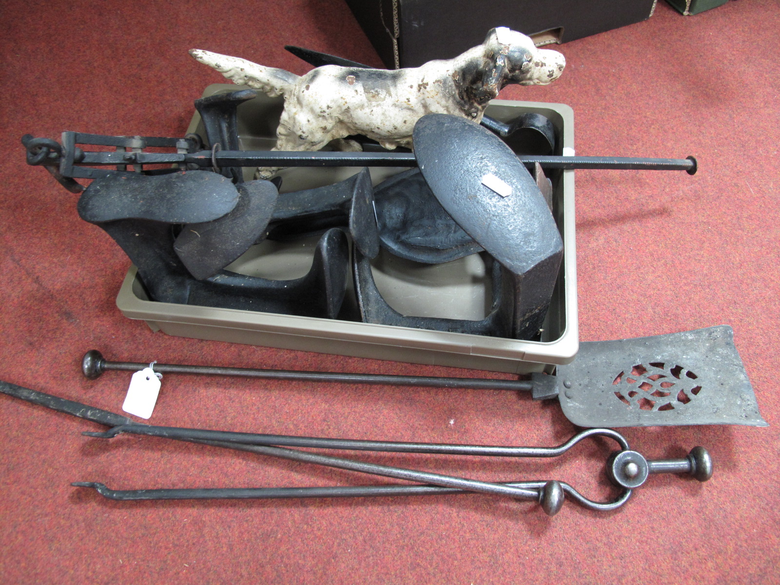 A Cast Iron Dog, 36.5cm long, shoe lasts, goose door stop, meat hook, fire irons.