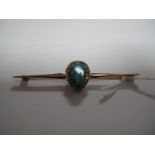 An Opal and Diamond Set Bar Brooch, the oval opal in matrix claw set within pear shape border of old