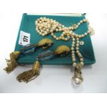A Long Imitation Pearl Bead Necklace; together with a pair of large costume drop earrings.
