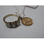 A 9ct Gold Three Stone Dress Ring, claw set; together with a 9ct gold St. Christopher pendant. (2)